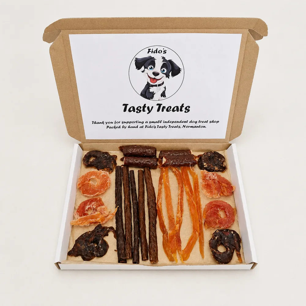 Open Small Try Me letterbox dog treat box with assorted softer chews and snacks, hand-packed by Fido’s Tasty Treats in Normanton